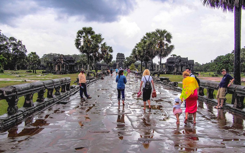 After the rain, tourists at Angkor.